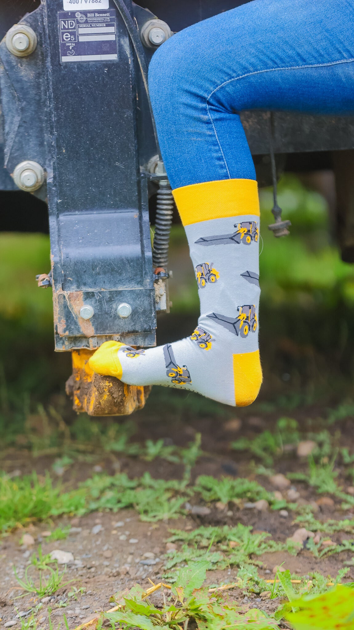 Show your country style with our grey and yellow-themed farm machinery telehandler socks! Featuring eye-catching telehandler designs, these comfortable and durable socks are perfect for agricultural enthusiasts. Made from soft, breathable material, they're great for any occasion, whether you're working on the farm or relaxing at home. Elevate your look and proudly showcase your passion for farm machinery with every step!