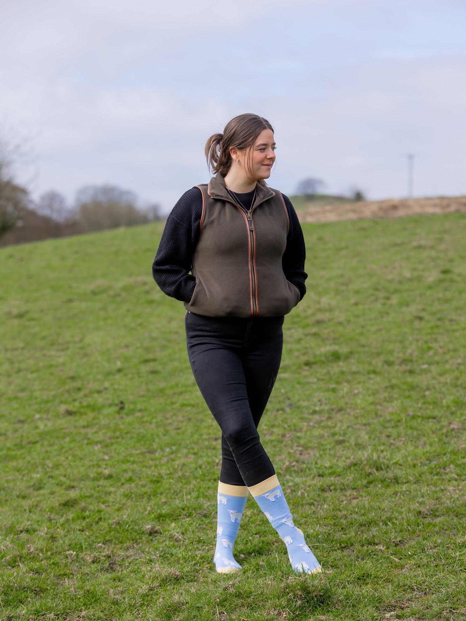 Unisex crew socks with a cute Spring vibe. Sporting baby white lambs, these cosy socks are on a sky blue background and a pastel yellow top, heel and toe