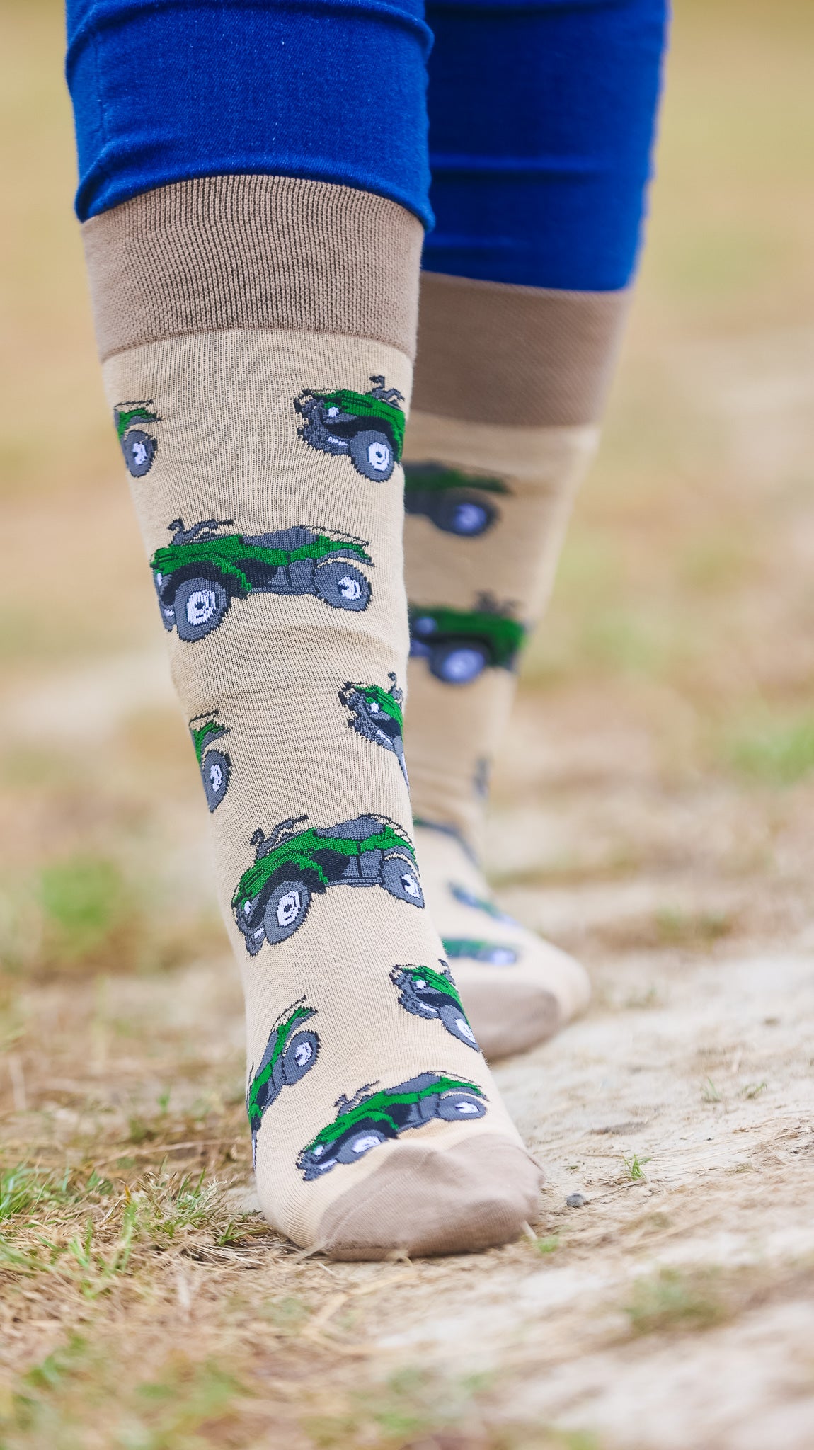 "These delightful darker olive quad bike socks feature a lively green quad bike design set against a light olive background, complemented by matching darker olive heel and toe accents. Perfect for adding a pop of color to your outdoor outfit, these socks combine comfort with a fun, adventurous touch. Showcase your passion for off-roading and cheerful style with these adorable and cozy socks!"