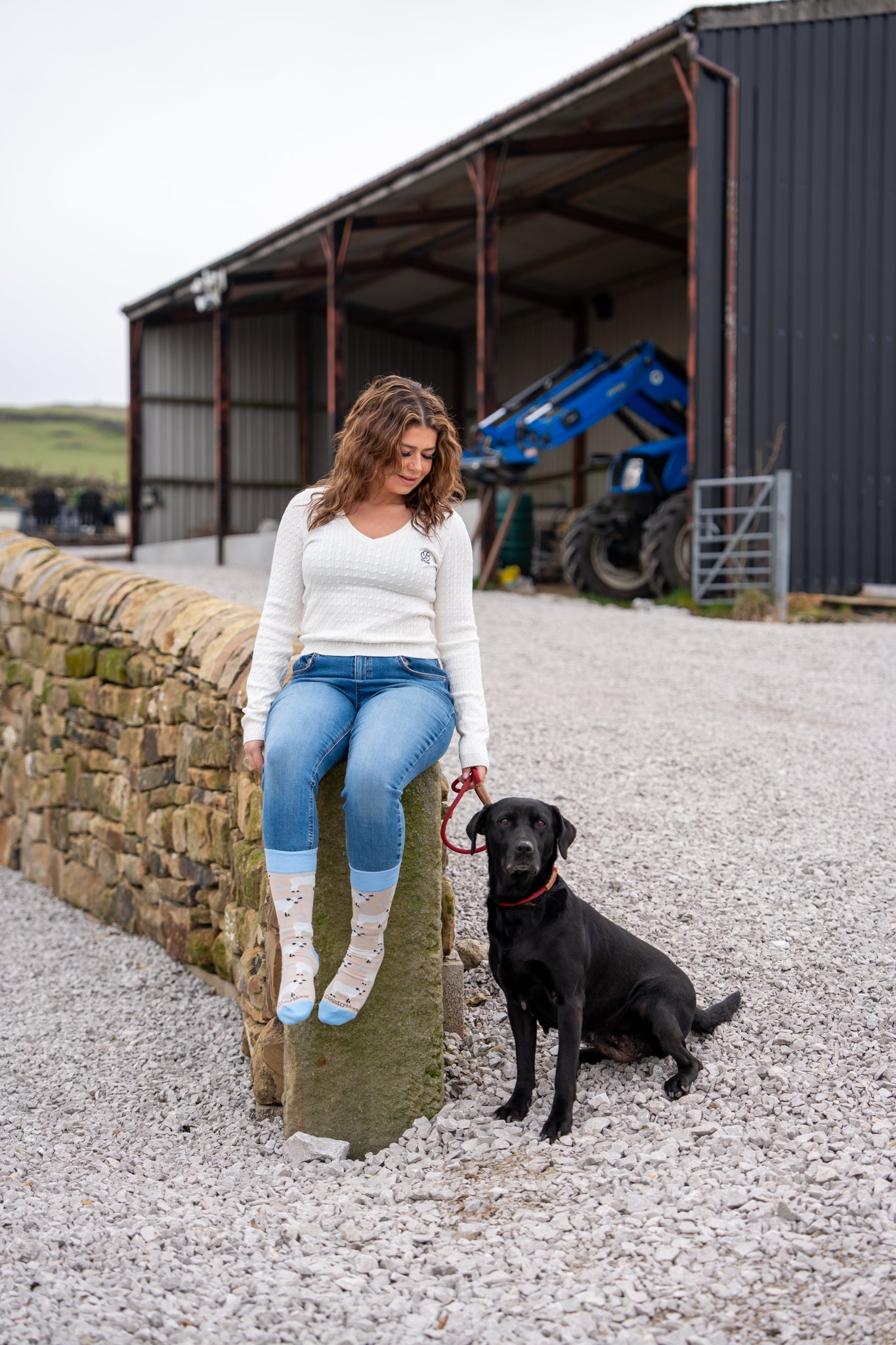 country girl modelling blue themed cow socks