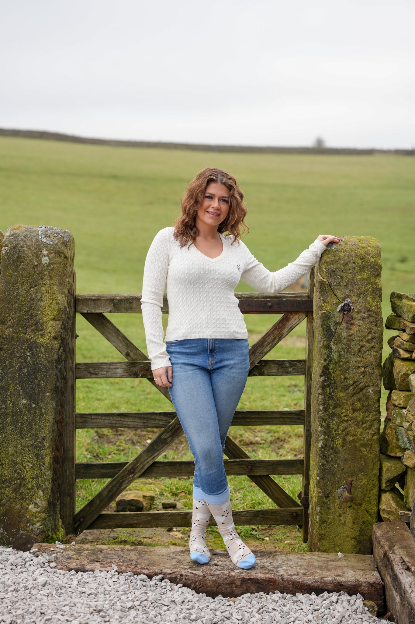 country girl wearing blue cow crew socks