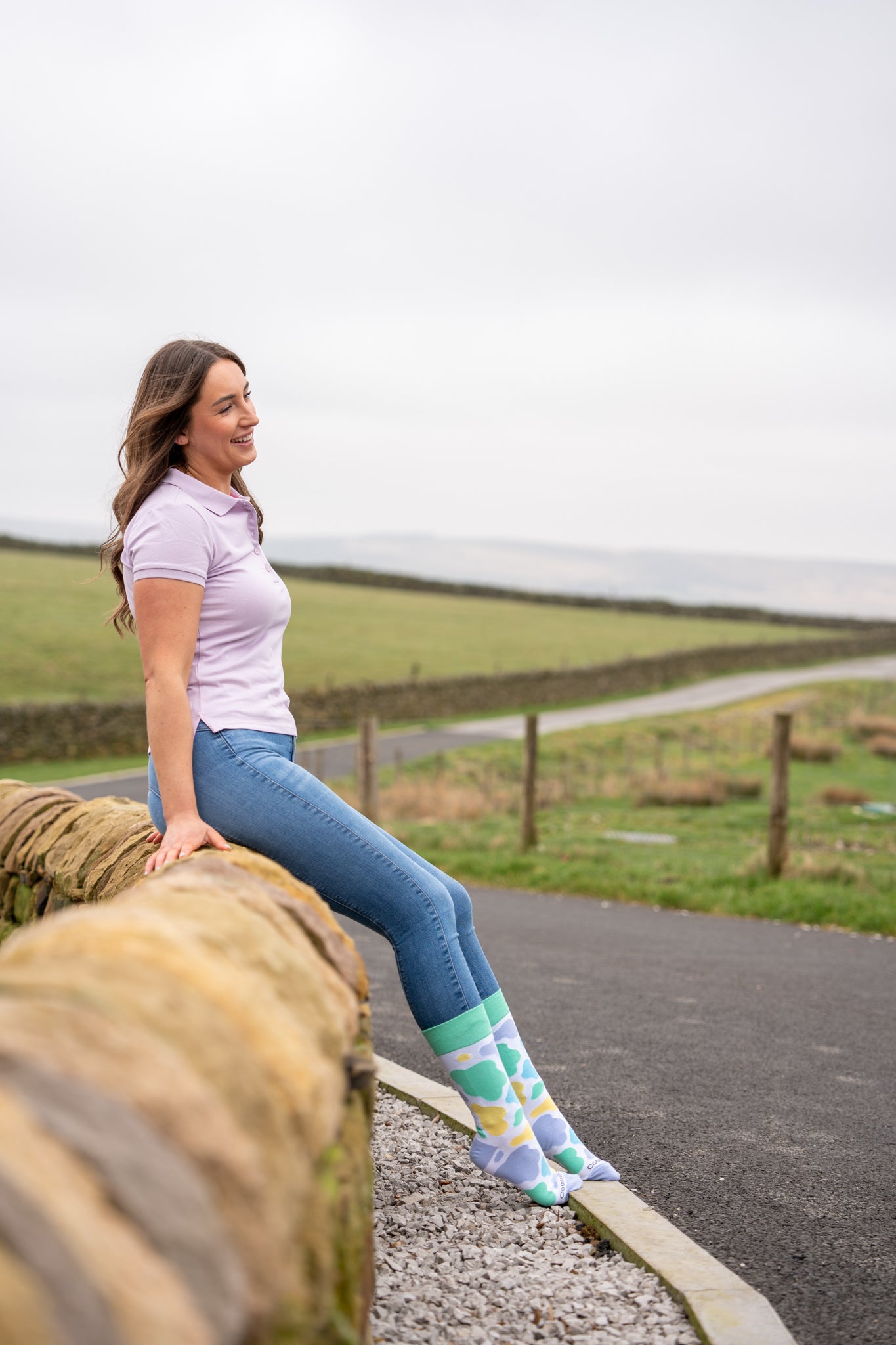 model wearing mix cow print crew socks