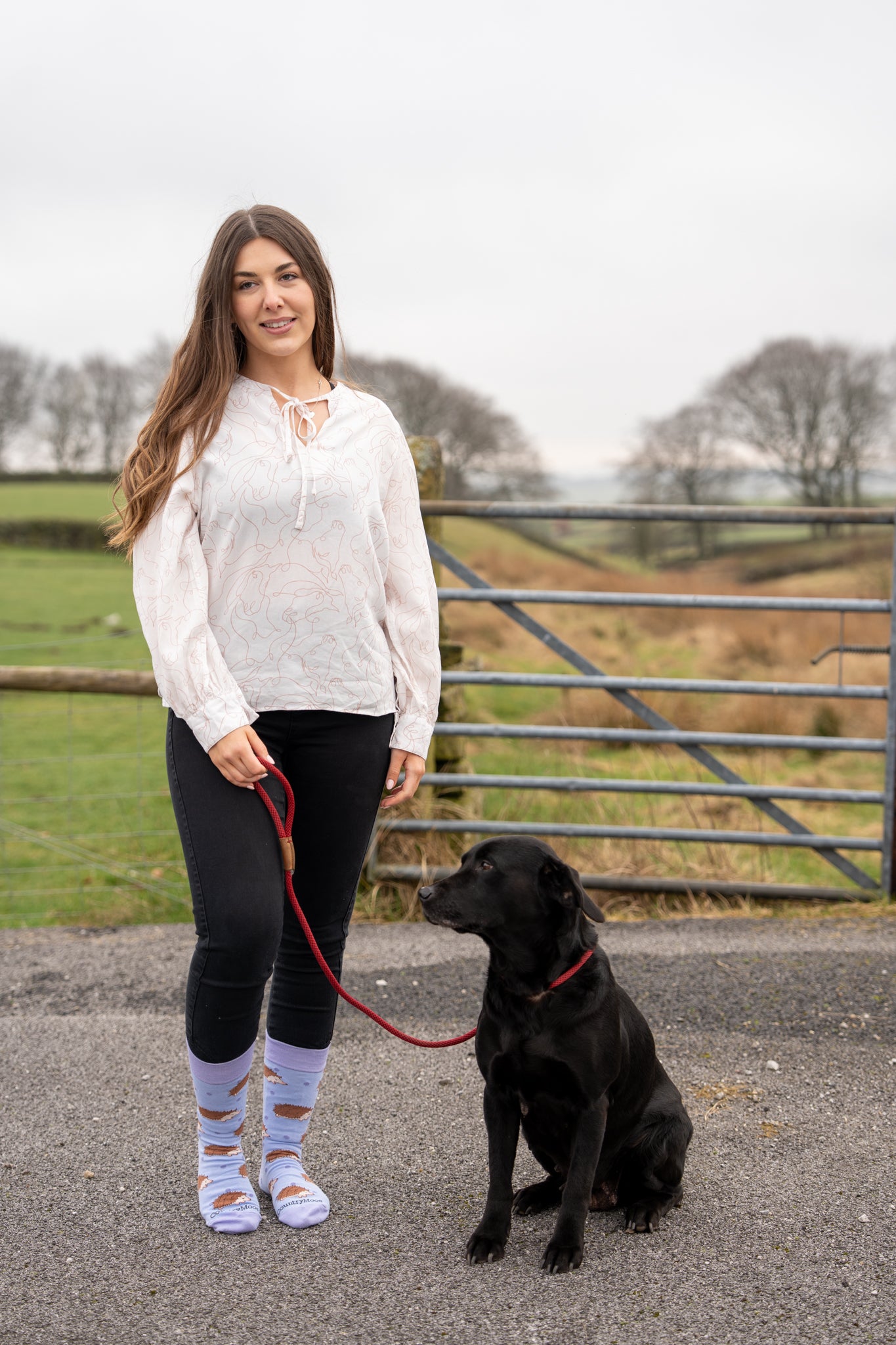 model wearing purple themed hedgehog socks