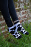 Trendy black and white cow print ankle socks, perfect for country fashion enthusiasts and animal lovers alike. These stylish socks feature a playful cow pattern, ideal for farm lovers and countryside aficionados who appreciate outdoor aesthetics. Designed for comfort and casual wear, these ankle socks make a fashionable statement while celebrating rural life.