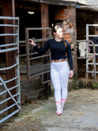 Pink themed cow socks. These cosy crew socks sport lack and white cows on a light pink background and a more vibrant top, heel and toe. 