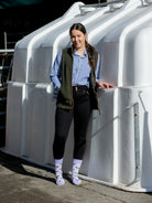 Unisex cow socks. A purple cow design with black cows on a light purple background and a darker purple top, heel and toe. 