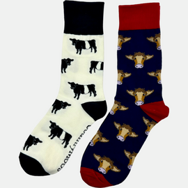 2 pairs of crew socks featuring a belted Galloway cow design on a light cream background, showcasing elegant black and white cows with an vibrantly elegant black top, heel, and toe. Also included are navy red cow socks, set against a navy backdrop adorned with playful brown cows, complemented by a vibrant royal red tops, heels, and toes. Perfect gifts for countryside enthusiasts, outdoor lovers and farming people, these cozy socks bring a touch of country style and comfort.