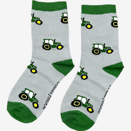 Adorable children's green tractor socks featuring playful green tractors against a stylish grey background, complete with matching green tops, heels, and toes. These fun and comfortable socks are perfect for young farm enthusiasts and add a touch of countryside charm to any outfit