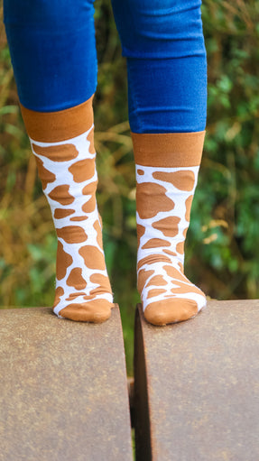 "Step up your style with our fabulous brown cow print socks, the perfect addition to your farm-themed wardrobe! Featuring a chic design inspired by the charm of the countryside, these cozy socks are both comfortable and trendy. Whether you're roaming the fields or relaxing at home, they add a playful touch to any outfit. Embrace the farm flair with these stylish brown cow print socks!"