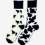  2 pairs of crew socks featuring a cow print design on a white background, showcasing elegant black cow print with an vibrant black top, heel, and toe. Also included are belted Galloway cow socks, set against a cream backdrop adorned with playful black and white cows, complemented by black tops, heels, and toes. Perfect gifts for countryside enthusiasts, outdoor lovers and farming people, these cozy socks bring a touch of country style and comfort.