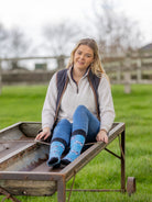 Cow crew socks with a timeless dairy cow design. Black and white cows on a sky blue background and black top, heel and toe. 