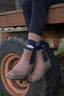 Charming pig socks designed for farmers, outdoor lovers, and countryside enthusiasts, featuring a navy background with playful pink and brown pigs, and light brown top, heel, and toe.