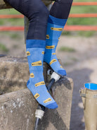 Crew socks with sheep 365 tags on a blue background and a darker blue top, heel and toe