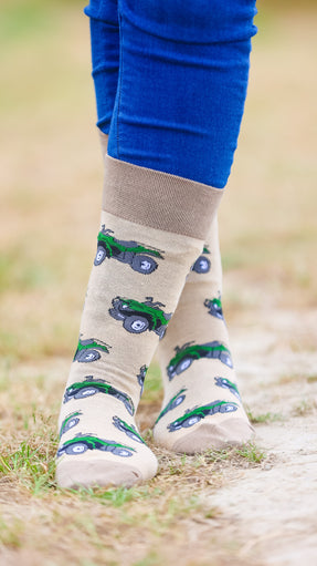 "These delightful darker olive quad bike socks feature a lively green quad bike design set against a light olive background, complemented by matching darker olive heel and toe accents. Perfect for adding a pop of color to your outdoor outfit, these socks combine comfort with a fun, adventurous touch. Showcase your passion for off-roading and cheerful style with these adorable and cozy socks!"