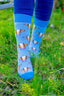 Blue striped cow socks showcasing a playful design on a white background, featuring vibrant blue stripes and cute brown cows. Perfect for adding a fun and cozy touch to your outfit, these socks are ideal for casual wear and a great way to embrace country charm.