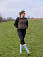 Unisex crew socks with a cute Spring vibe. Sporting baby white lambs, these cosy socks are on a sky blue background and a pastel yellow top, heel and toe 