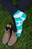 Vibrant mint green and white cow print ankle socks, perfect for country fashion enthusiasts and animal lovers alike. These stylish socks feature a playful cow pattern, ideal for farm lovers and countryside aficionados who appreciate outdoor aesthetics. Designed for comfort and casual wear, these ankle socks make a fashionable statement while celebrating rural life.