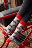 Red country-style tractor socks featuring a modern tractor design on a grey background, accented with a matching red top, heel, and toe. These cozy and stylish socks are perfect for farmers and tractor enthusiasts who love the countryside, offering both comfort and a touch of country charm for everyday wear.