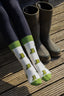 Welly socks featuring a playful design of green wellington boots on a cream background, with coordinating green accents on the top, heel, and toe. These comfortable and stylish country socks are perfect for rainy days and outdoor adventures, adding a touch of fun to your footwear while keeping your feet warm and cozy.