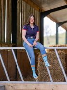 Unisex crew socks with a pig design. With a mixture of brown and black pigs on a bright sky blue background and brown top, heel and toe.