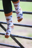 Mix cow socks featuring a cream background with charming brown top heel and toe accents and brown, black and grey cows. Perfect for adding a gracious touch to your footwear collection. Ideal for casual wear, these cozy, stylish cow socks celebrate country farm living and ensure comfort for all occasions.