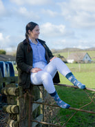 Unique Texel Sheep socks. These unisex crew socks have cream Texel sheep on a light blue background and a darker blue top, heel and toe. 