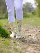 Unisex dog socks. These cosy crew socks sport red Labradors on a light lime green background and a pastel coloured yellow for the top, heel and toe. 
