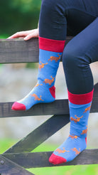 Step out in style with our blue and red-themed stag socks, featuring striking brown stags gracefully depicted against a vibrant backdrop. Perfect for outdoor enthusiasts or cozy days at home, these comfortable socks add a bold touch to any outfit, making them an ideal choice for wildlife lovers and those looking to infuse a bit of nature-inspired flair into their wardrobe.