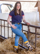 Unisex crew socks with a black and white cow design. On a light brown background and a golden yellow top, heel and toe to compliment the Hereford cows.