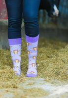 Step out in style with our purple and white striped cow socks featuring adorable black and white cows. Perfect for outdoor adventures or cozy days at home, these comfy socks add a playful touch to any outfit, making them ideal for cow lovers and those looking to elevate their wardrobe.