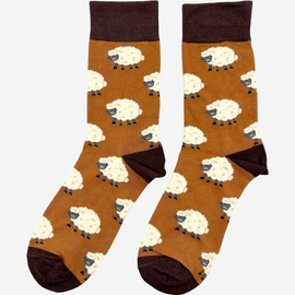 Cozy sheep socks designed for countryside lovers and outdoor enthusiasts, featuring a lighter brown background with charming brown and white sheep, accented by a dark brown top, heel, and toe for a stylish country fashion look