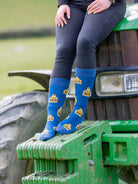 Cow Socks in a crew style. Designed with yellow cow tags saying cows 365 on a dark blue background and a lighter blue top, heel and toe