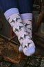 Purple cow socks featuring playful black and white cow designs. These stylish and cozy socks add a fun country touch to your outfit while embracing a whimsical farm theme. Perfect for animal lovers, country and outdoor enthusiasts, these socks are ideal for casual wear and adding a pop of colour to your sock collection and country style outfit.