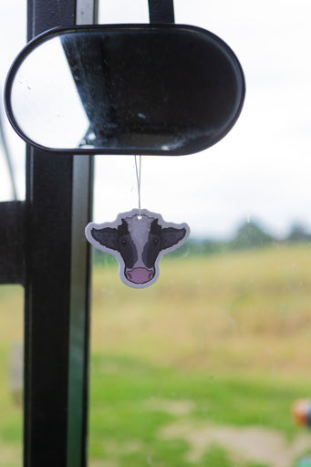 Double-sided black and white cow air fresheners featuring a charming farm and countryside theme, designed to evoke rustic vibes. Infused with a refreshing black ice scent, these unique air fresheners add a tasteful touch to any space while keeping it pleasantly fragrant.