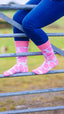 "Step into style with our charming pink cow print socks, perfect for adding a fun, farm-themed twist to your outfits! Inspired by the whimsical spirit of the countryside, these cozy socks are designed for ultimate comfort while keeping your look playful and trendy. Ideal for both farm adventures and cozy nights in, these socks will surely become your new favorite accessory. Embrace the farm vibe and elevate your sock game.