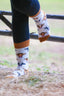 Mix cow socks featuring a cream background with charming brown top heel and toe accents and brown, black and grey cows. Perfect for adding a gracious touch to your footwear collection. Ideal for casual wear, these cozy, stylish cow socks celebrate country farm living and ensure comfort for all occasions.