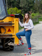 A unique red tractor design. These cosy crew socks are sporting vibrant red tractors on a light grey background and same colour red top, heel and toe. 
