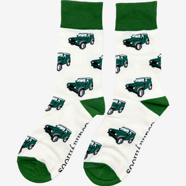 Land Rover socks showcasing a charming pattern of Land Rover vehicles on a cream background, complemented by matching green accents on the top, heel, and toe. These stylish country and comfortable socks are perfect for outdoor enthusiasts and Land Rover fans, adding a rugged touch to any outfit while ensuring all-day comfort.