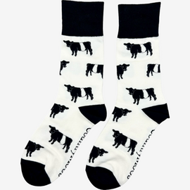 Belted Galloway cow socks designed with charming black and white Belted Galloway illustrations on a light cream background, complemented by black accents on the top, heel, and toe. These cozy socks are perfect for cow and countryside enthusiasts, offering a elegant touch to any country farm inspired outfit.