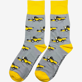 Country style combine harvester socks featuring a sleek grey background adorned with bold yellow combine harvesters, complemented by matching yellow tops, heels, and toes. These unique socks are perfect for farm, countryside and outdoor enthusiasts that adds a touch of rural flair to any wardrobe.