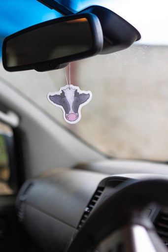 Double-sided black and white cow air fresheners featuring a charming farm and countryside theme, designed to evoke rustic vibes. Infused with a refreshing black ice scent, these unique air fresheners add a tasteful touch to any space while keeping it pleasantly fragrant.