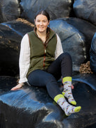 Unisex farm forager socks. The crew socks are of a farming theme around silage season and have green foragers on a grey background and matching green top, heel and toe. 
