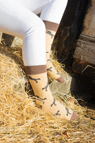 Unisex horse crew socks. These cosy horse socks sport black rearing horses on a light brown background and dark brown top, heel and toe. 