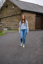 Country girl walking wearing green cow ankle socks 