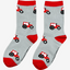 Adorable children's red tractor socks featuring playful red tractors against a stylish grey background, complete with matching red tops, heels, and toes. These fun and comfortable socks are perfect for young farm enthusiasts and add a touch of countryside charm to any outfit