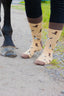 Western country style socks featuring playful cowboy hats and cow boots on a rich brown background, with a darker brown accent on the top, heel, and toe. These stylish and comfortable socks are perfect for cowboys and country lovers alike, adding a fun, rustic flair to your country wardrobe while embodying the spirit.