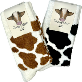 pack of two Cozy country style fluffy socks featuring a striking brown and white cow plus black and white print design. These socks are perfect for adding a fun, rustic touch to your wardrobe while providing ultimate comfort. Ideal for cow lovers and anyone who appreciates a playful yet stylish accessory, these socks are a must-have for lounging or outdoor adventures