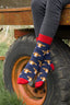 Cow socks featuring a vibrant red top, heel, and toe against a stylish navy blue background. These eye-catching brown cow socks blend playful cow motifs with a bold color scheme, ideal for animal lovers and fashion enthusiasts alike. Perfect for adding a fun and unique touch to your sock collection while ensuring comfort for everyday wear.