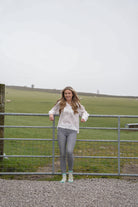 country girl leaning wearing valais blacknose sheep ankle socks 