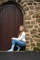 country girl modelling blue themed lamb sheep socks